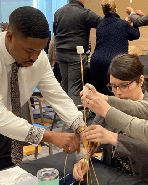 Three people working together on a project.