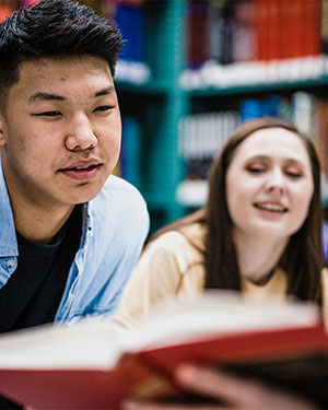 Students looking at a book