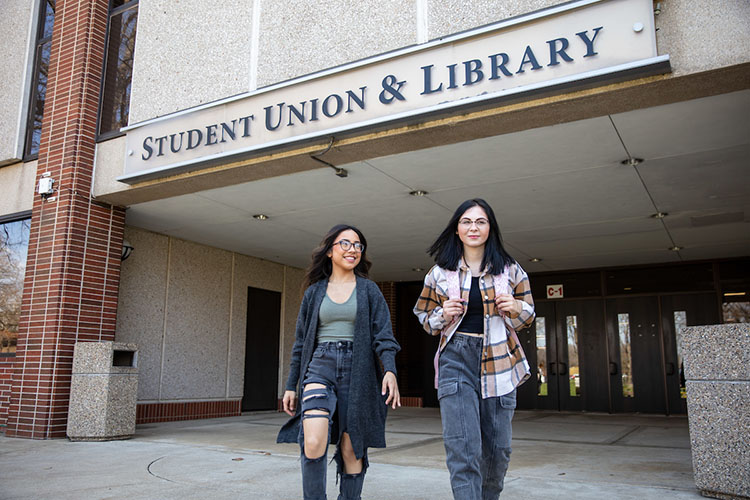 Students walk out of PNW's Student Union and Library Building