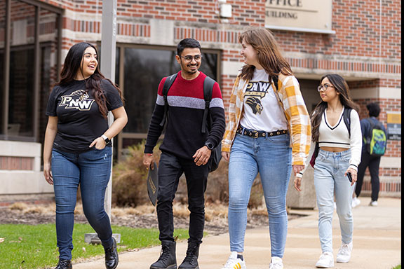 Students walk together across campus