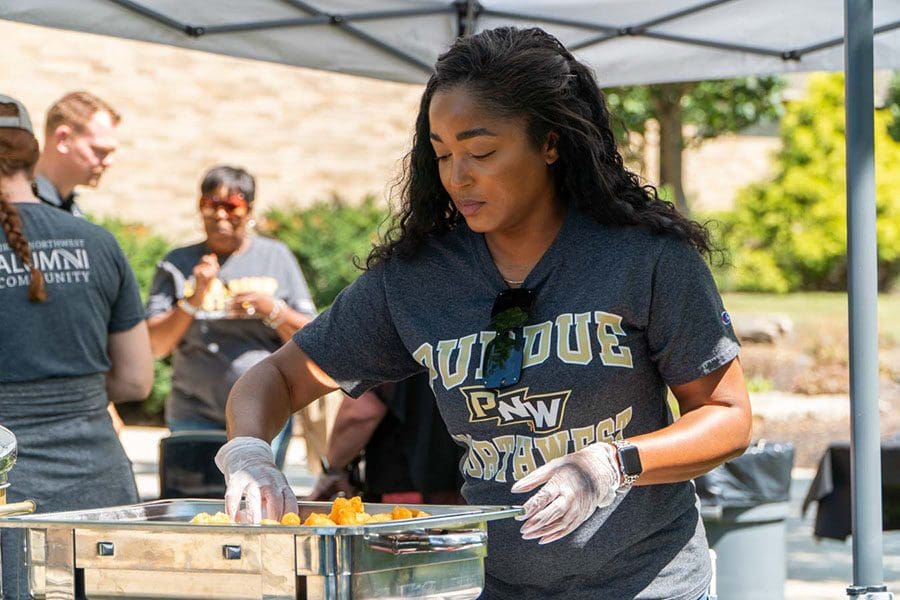 Employee dishes out tatchos