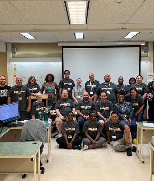 Group of teachers stand together during the Gen Cyber Camp