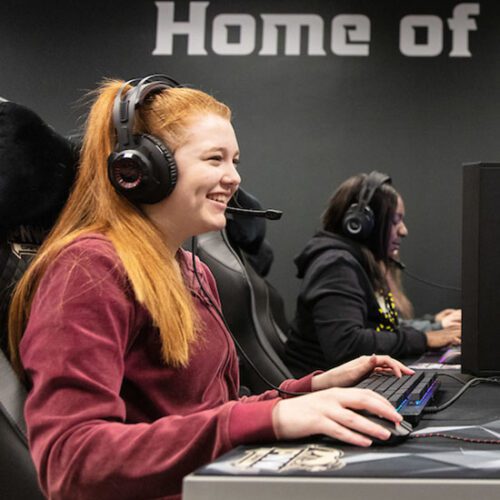 A PNW Esports athlete competing on a computer