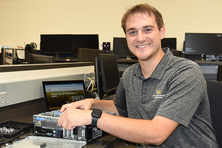 Chad Jamrock posing with a computer