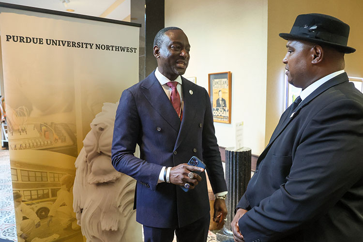 Yusef Salaam, left, speaks with Maceo Rainey, director of TRIO Education Talent Search at PNW’s Westville campus ahead of the CJPA’s “Grand Reveal” Dinner at the Center for Visual and Performing Arts in Munster.