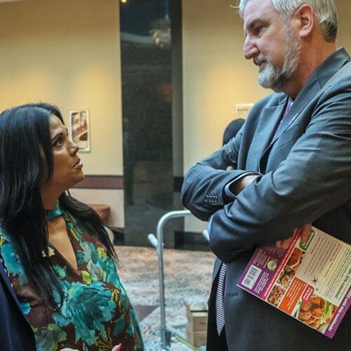 Nicky Ali Jackson, professor of Criminal Justice, speaks with Indiana Gov. Eric Holcomb ahead of the CJPA’s “Grand Reveal” Dinner at the Center for Visual and Performing Arts in Munster.