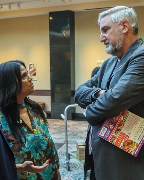 Nicky Ali Jackson, professor of Criminal Justice, speaks with Indiana Gov. Eric Holcomb ahead of the CJPA’s “Grand Reveal” Dinner at the Center for Visual and Performing Arts in Munster.