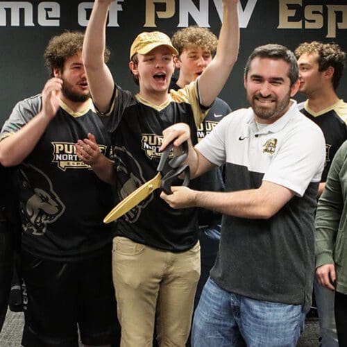 Students celebrate during the Esports ribbon cutting