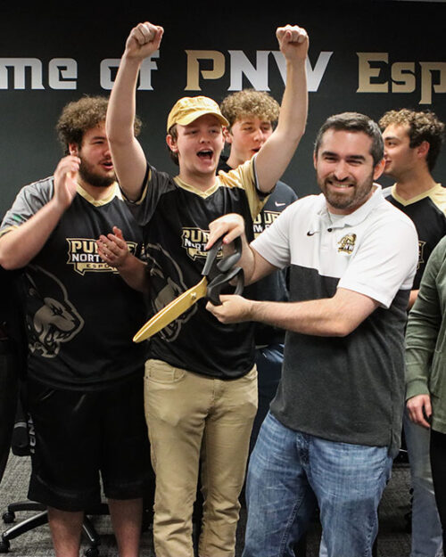 Students celebrate during the Esports ribbon cutting