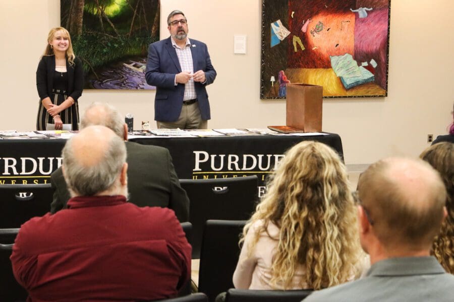 Joseph Coates, right, reference librarian manager, and Kayla Vasilko, graduate student assistant, helped lead the time capsule dedication program.