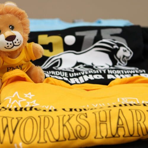 Some of the contributed items to the time capsule included a plush lion from Student Government Association and various PNW-themed t-shirts.