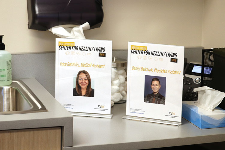 Staff photos in a Center for Healthy Living exam room.