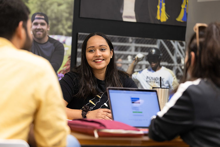 PNW students collaborate on a laptop