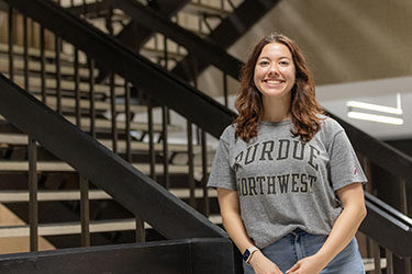 A PNW student in the Student Union and Library Building