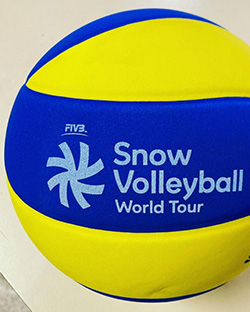 A blue and yellow ball that says Snow Volleyball World Tour