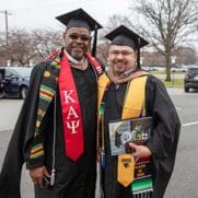 PNW Executive MBA graduates pose together at commencement.