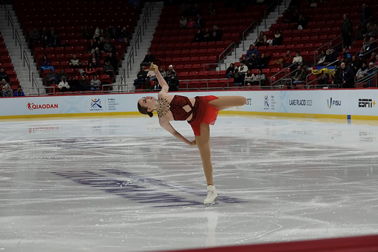 Finley Hawk spins on the ice on one skate