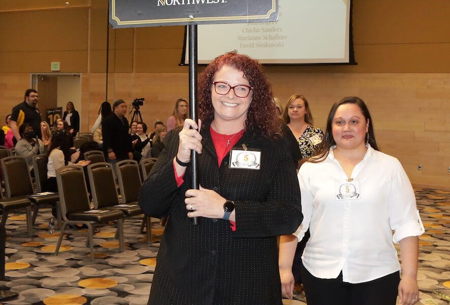 PNW staff and faculty who have completed five years of service walk out in line.