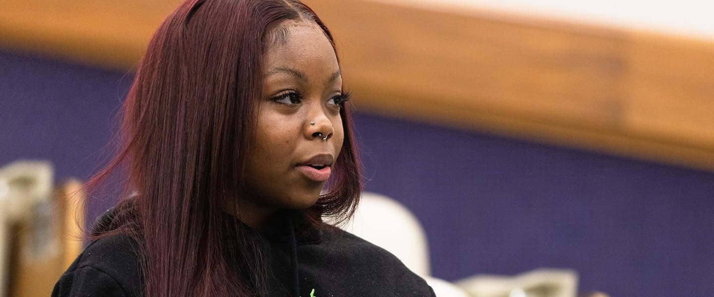 A PNW student listens in the classroom