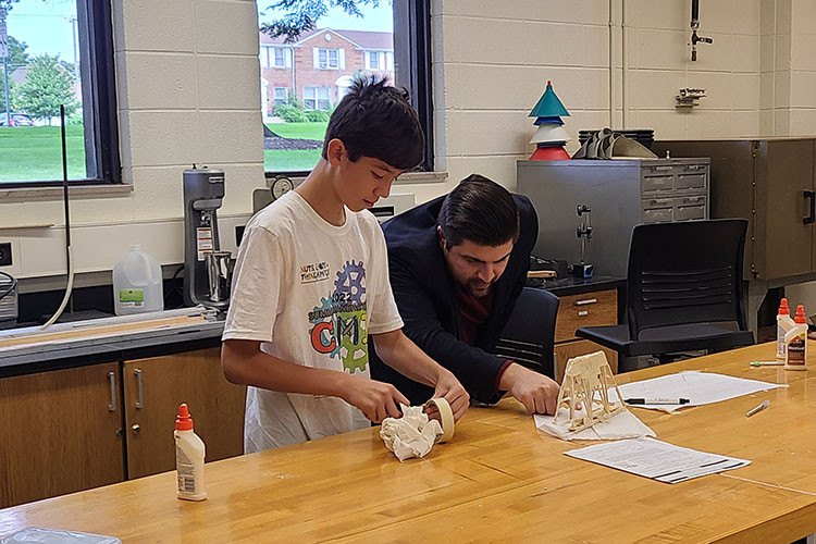 Boy and Professor construct a bridge