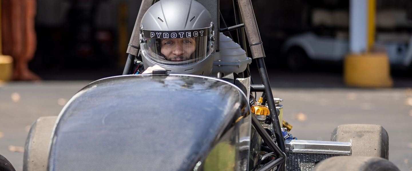 An engineering student in a race car.