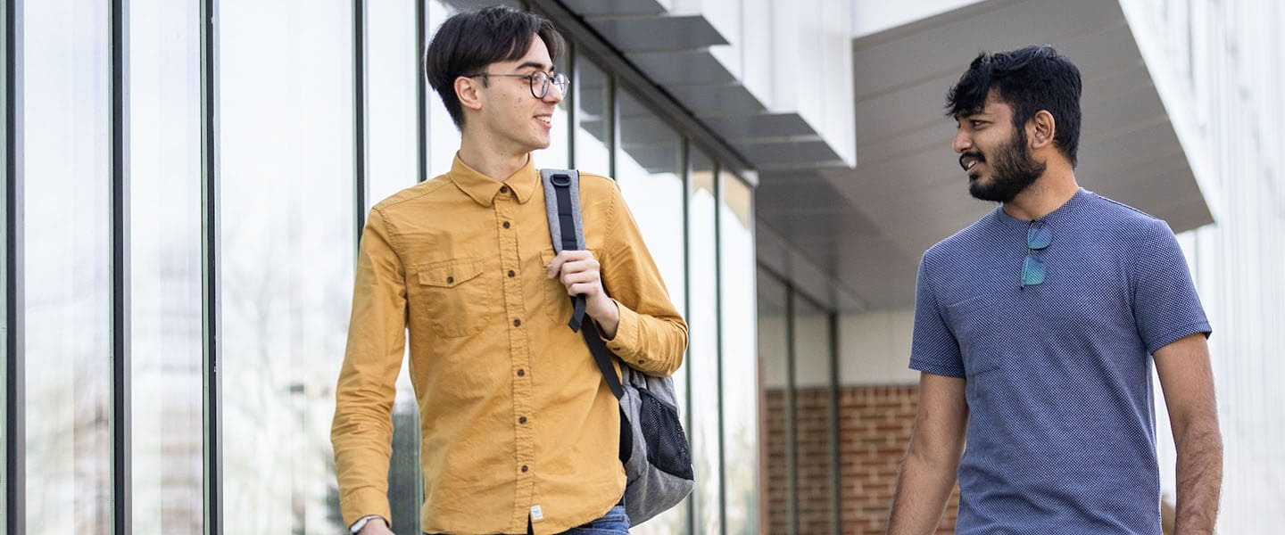 Students walk outdoors on PNW's campus