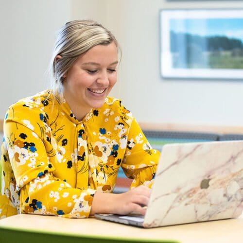 A PNW student studies on a laptop