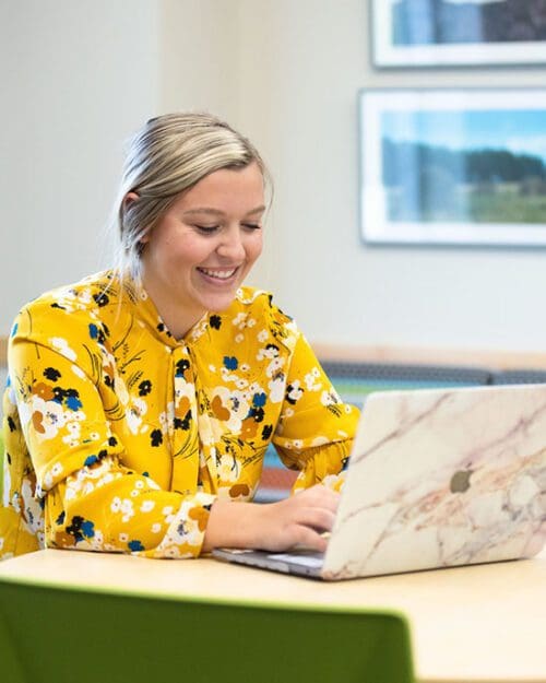 A PNW student studies on a laptop