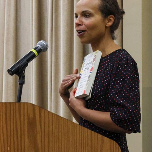 Deirdre Mask stands at a podium.