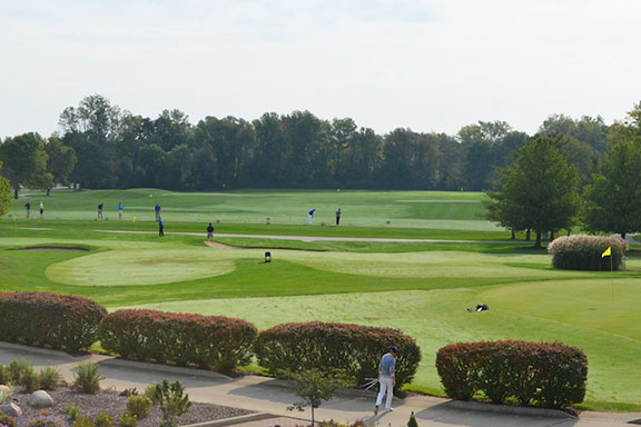Golfers on the fairway at the PNW Powers Golf Outing.