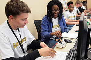 Students work on projects during the Gen Cyber camp