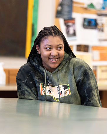 A student smiles during class