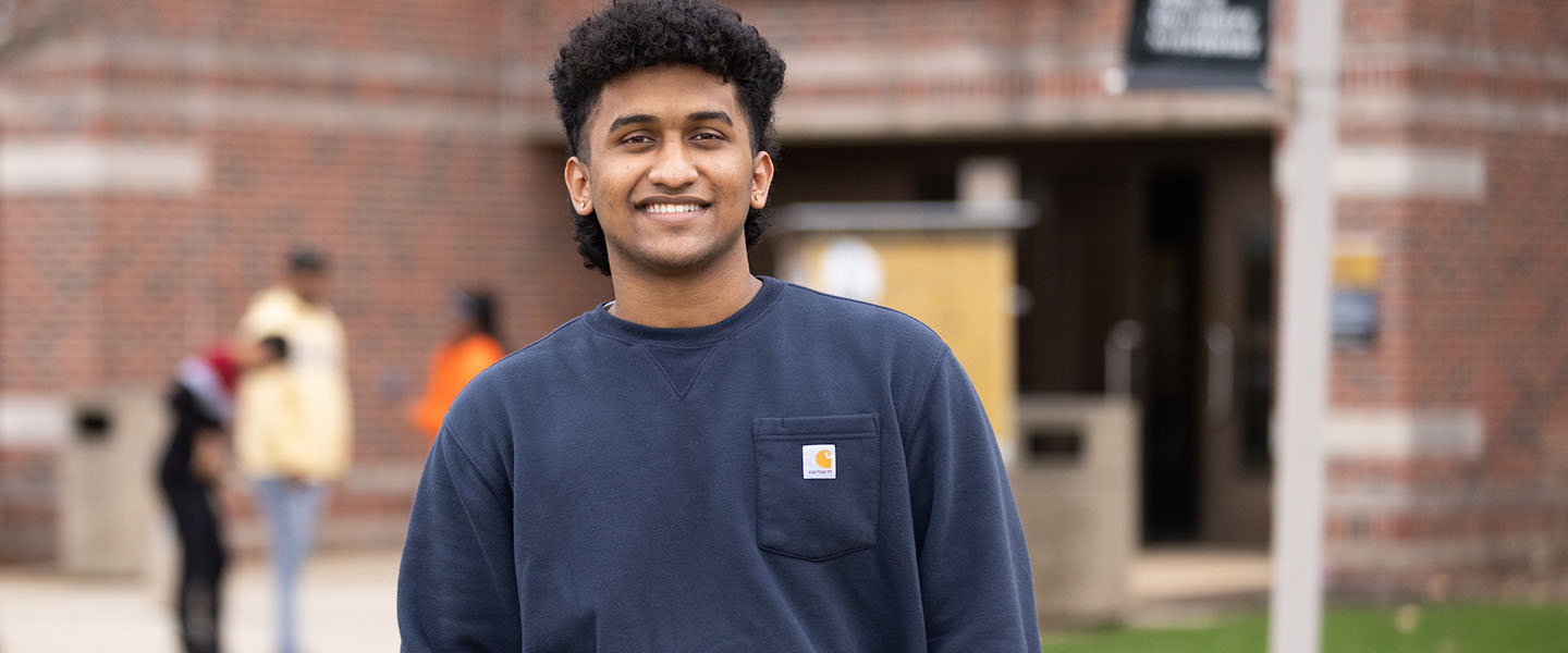 A PNW student smiles outdoors