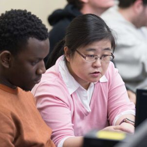 PNW students work together at a computer