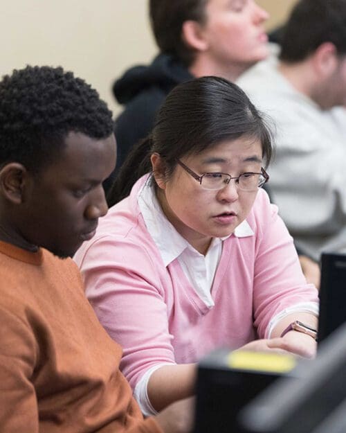 PNW students work together at a computer