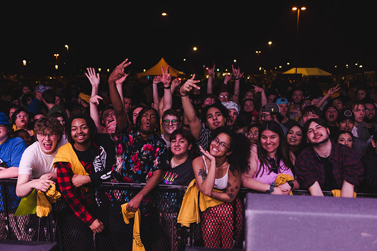 Students gather during an outdoor concert