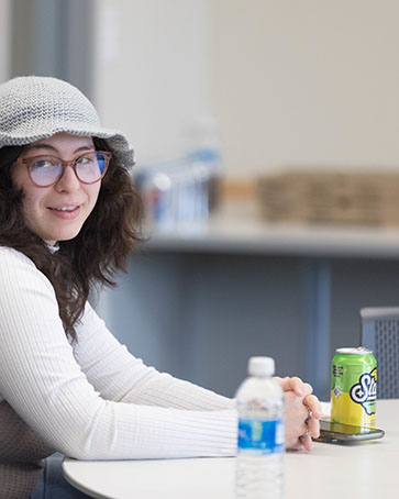 A student sits at a table on PNW's Westville branch campus.