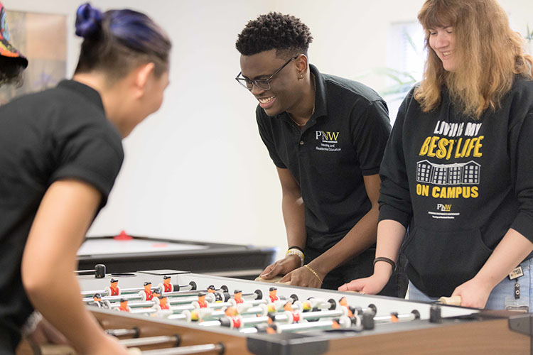 PNW students play foosball