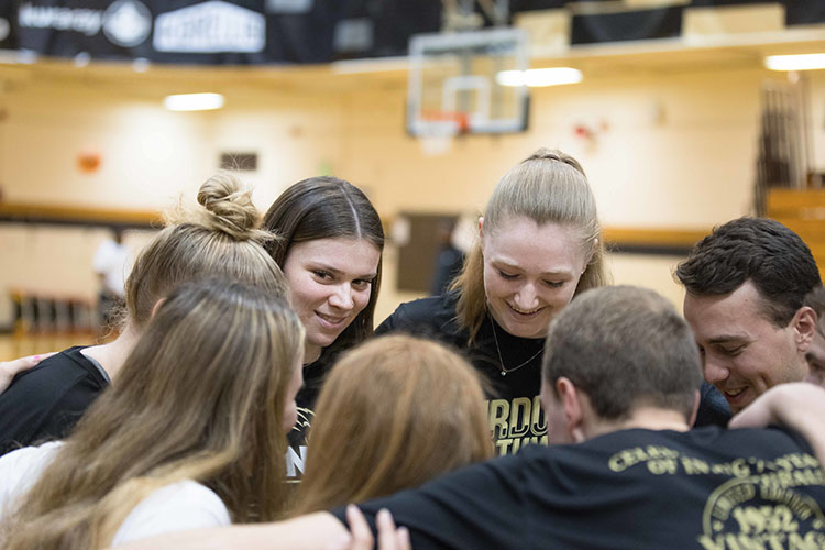 PNW students huddle during intramural sports