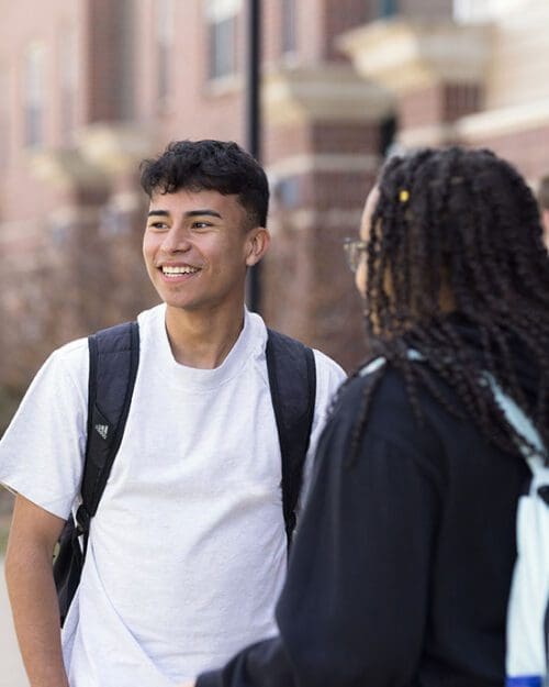 PNW students talk together on campus