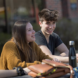 PNW students sit together at an outdoor table