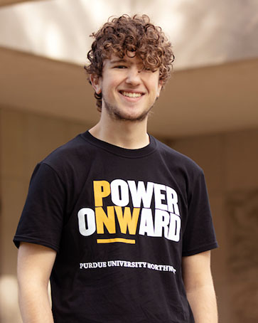 A PNW student in a Power Onward shirt