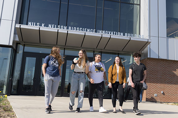 PNW students walk in front of the Nils K Nelson Bioscience Innovation Building