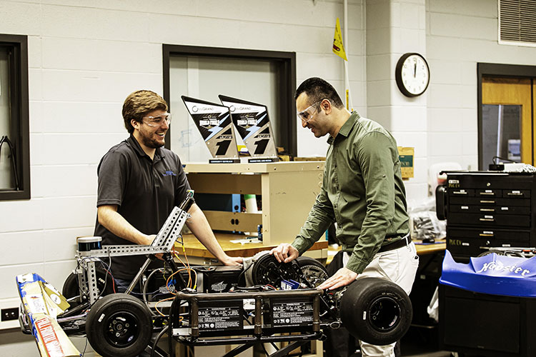 PNW professor Khair al Shamaileh and a student work together in the lab