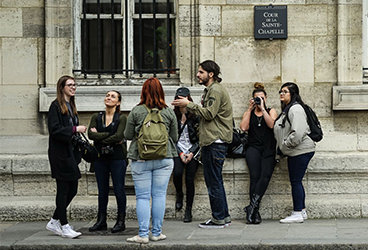 PNW students stand on a street outdoors in France
