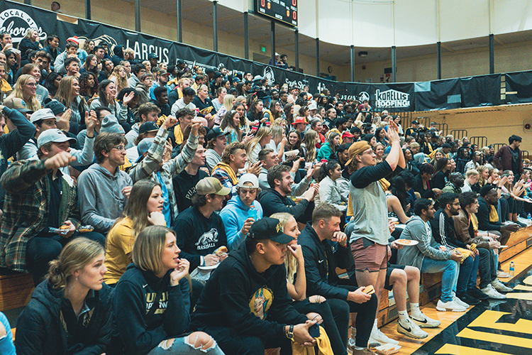 Students gather on the bleachers in the FRC for Late Night Madness