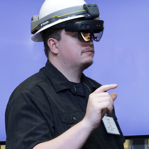 Kyle Toth wears a VR helmet.