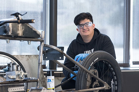A PNW student working on an electric bike