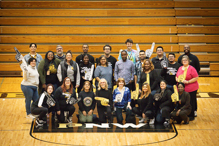 First-Generation faculty, staff and students stand together in FRC