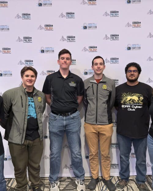 Six PNW students pose for photo at the Cyberforce Competition